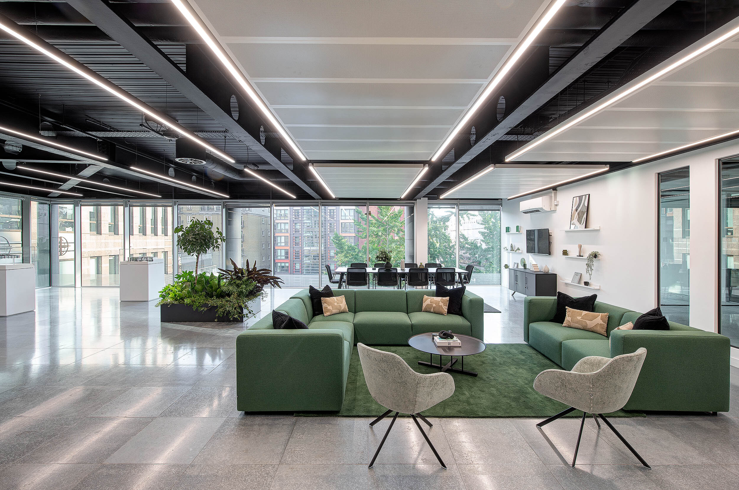 Spacious marketing suite interior at 95 Queen Victoria Street designed by Two, showcasing comfortable seating, natural light, and contemporary furnishings.