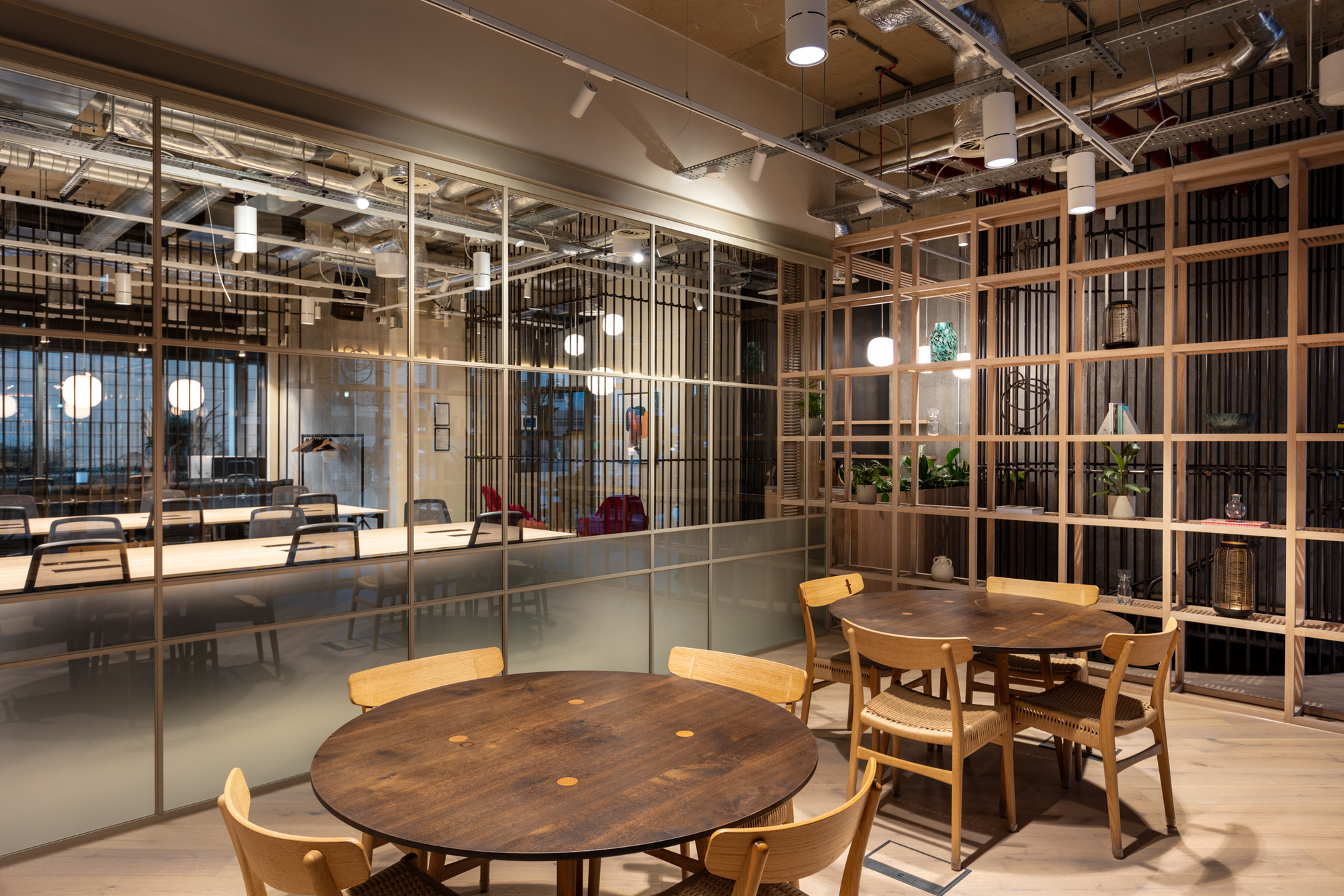 Bespoke shelving and communal seating area in the FORA Borough Market office, designed by Two for modern professionals.