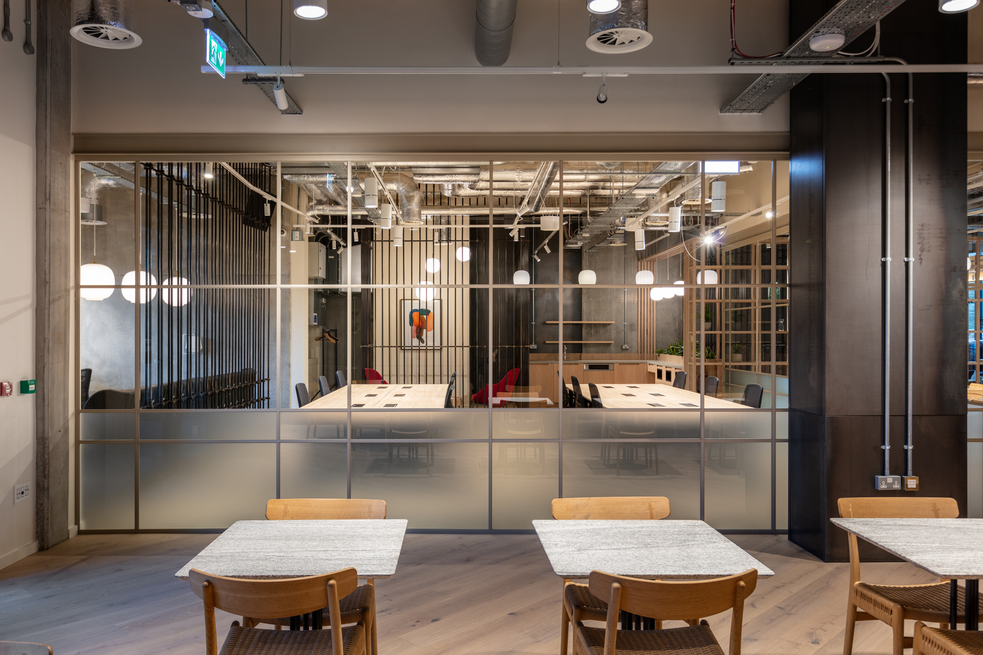 FORA Borough Market, designed by Two, with modern desks, pendant lighting, and natural wood finishes in the coworking space.