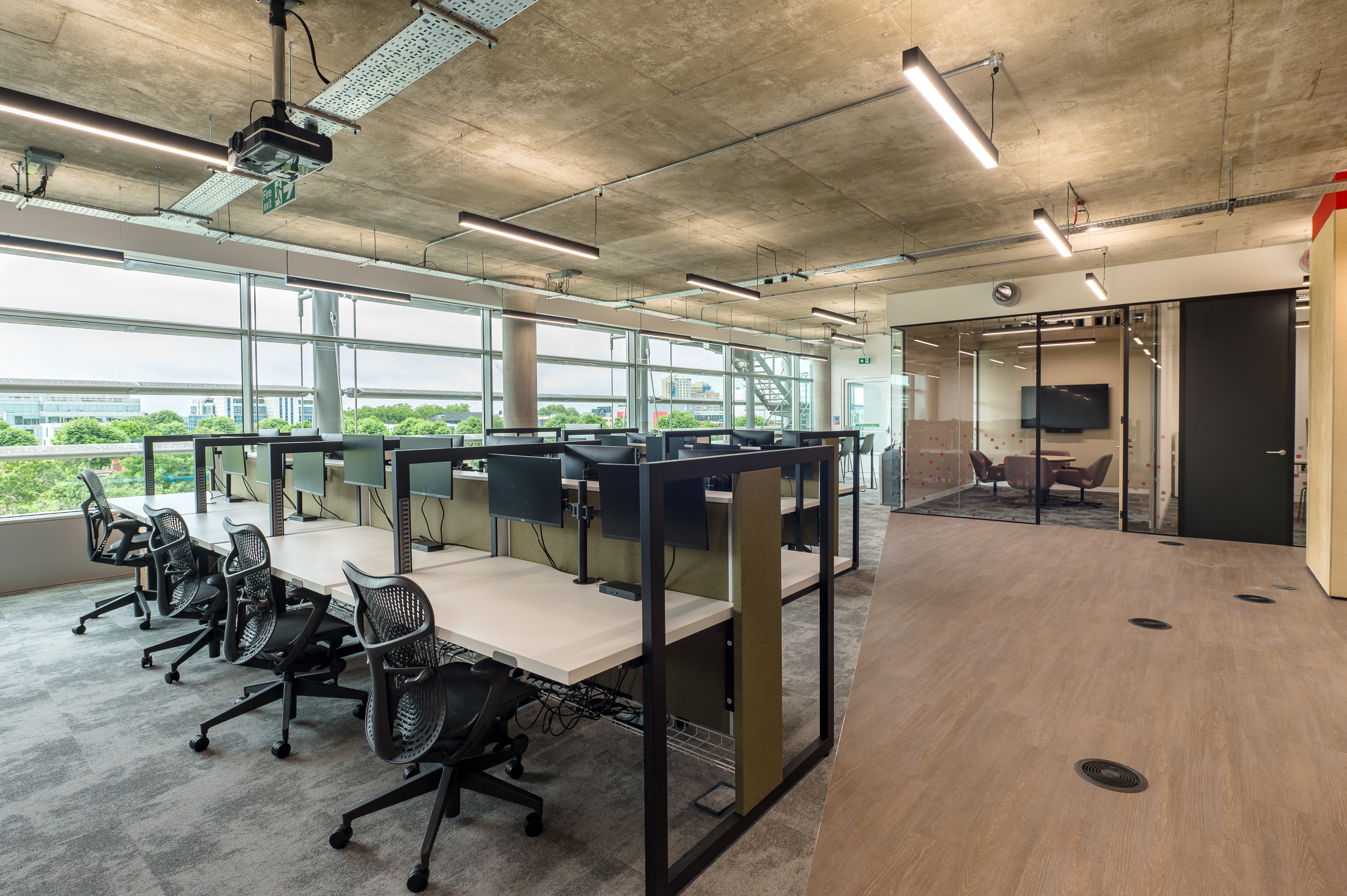 Bright open-plan workspace in MicroStrategy’s office, designed by Two, with a focus on ergonomic setups and natural light.