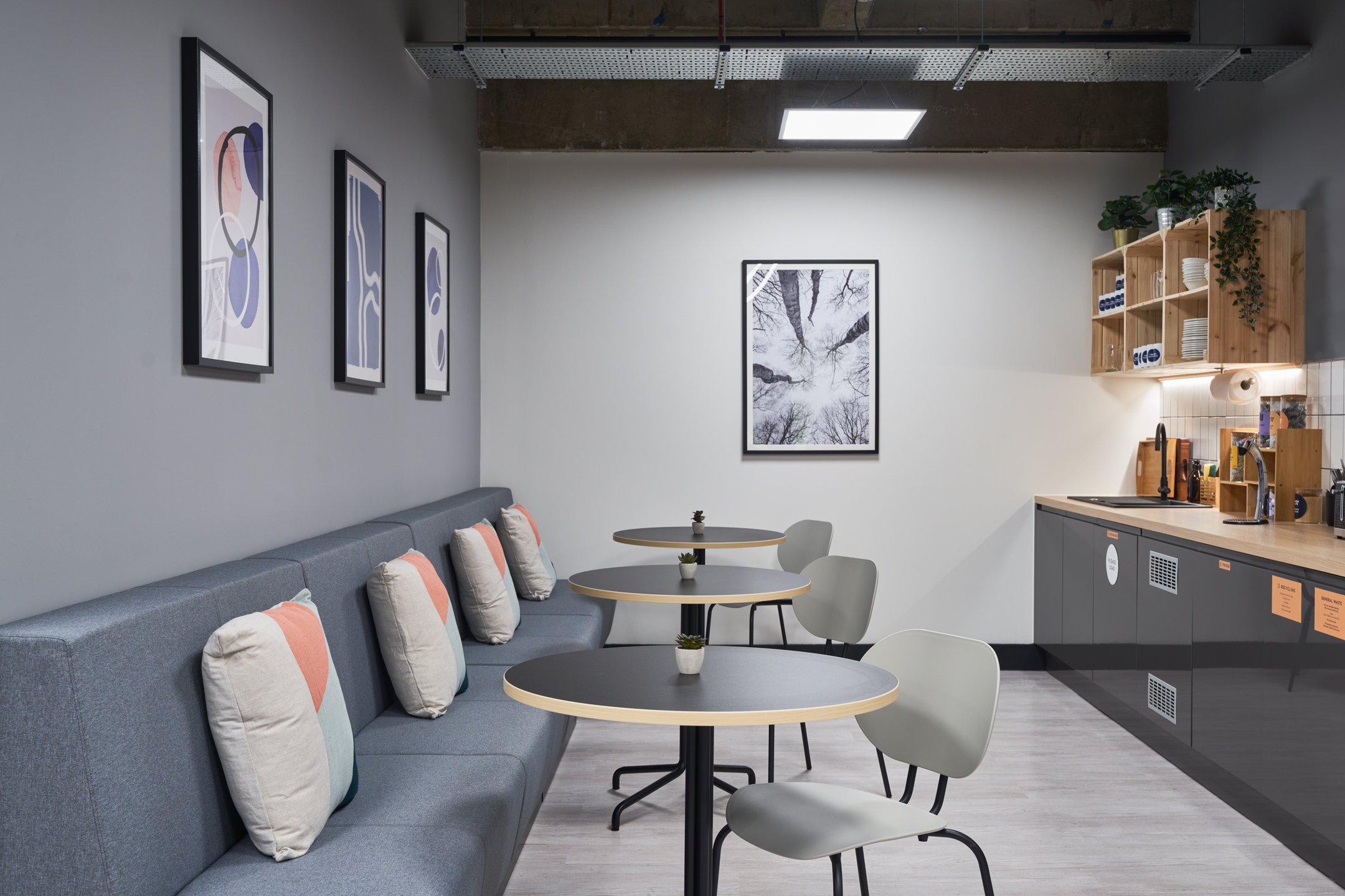 A comfortable lounge area at Work.life Liverpool Street, designed by Two, with minimalist decor, cosy seating, and soft lighting, perfect for informal meetings or workspace downtime.