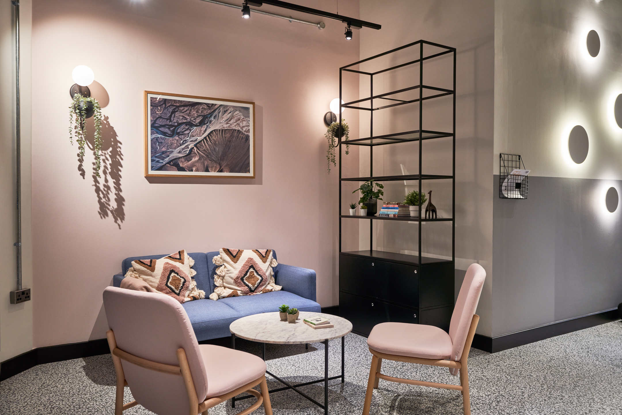 A welcoming reception area at Work.life Liverpool Street designed by Two, featuring clean modern lines, natural wood panelling, and greenery to create a professional first impression for workspace visitors.
