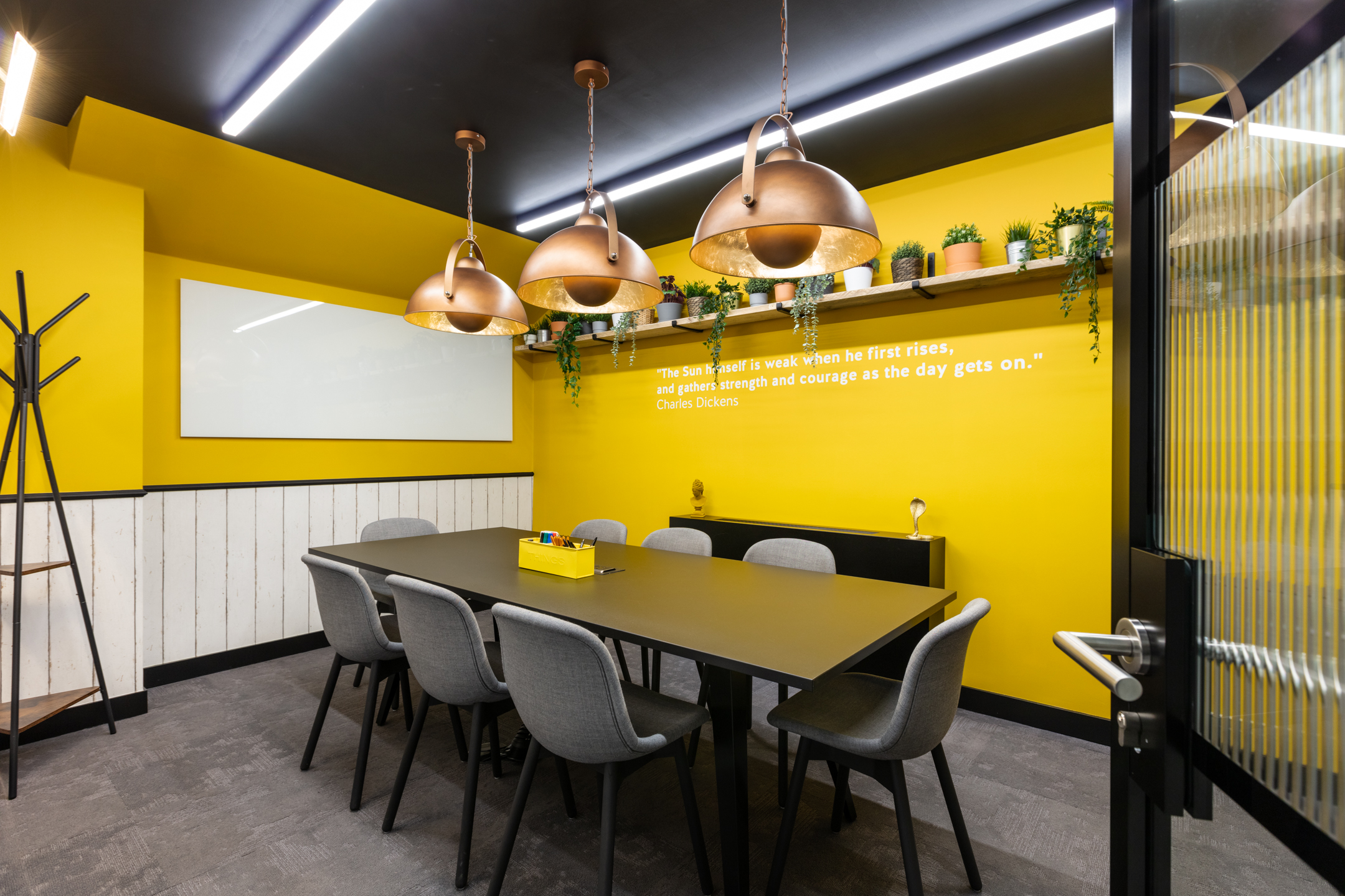 A bold and creative yellow meeting room at Work.life Red Lion Street, designed by Two to energise workspace users with pops of colour and inspiring décor.