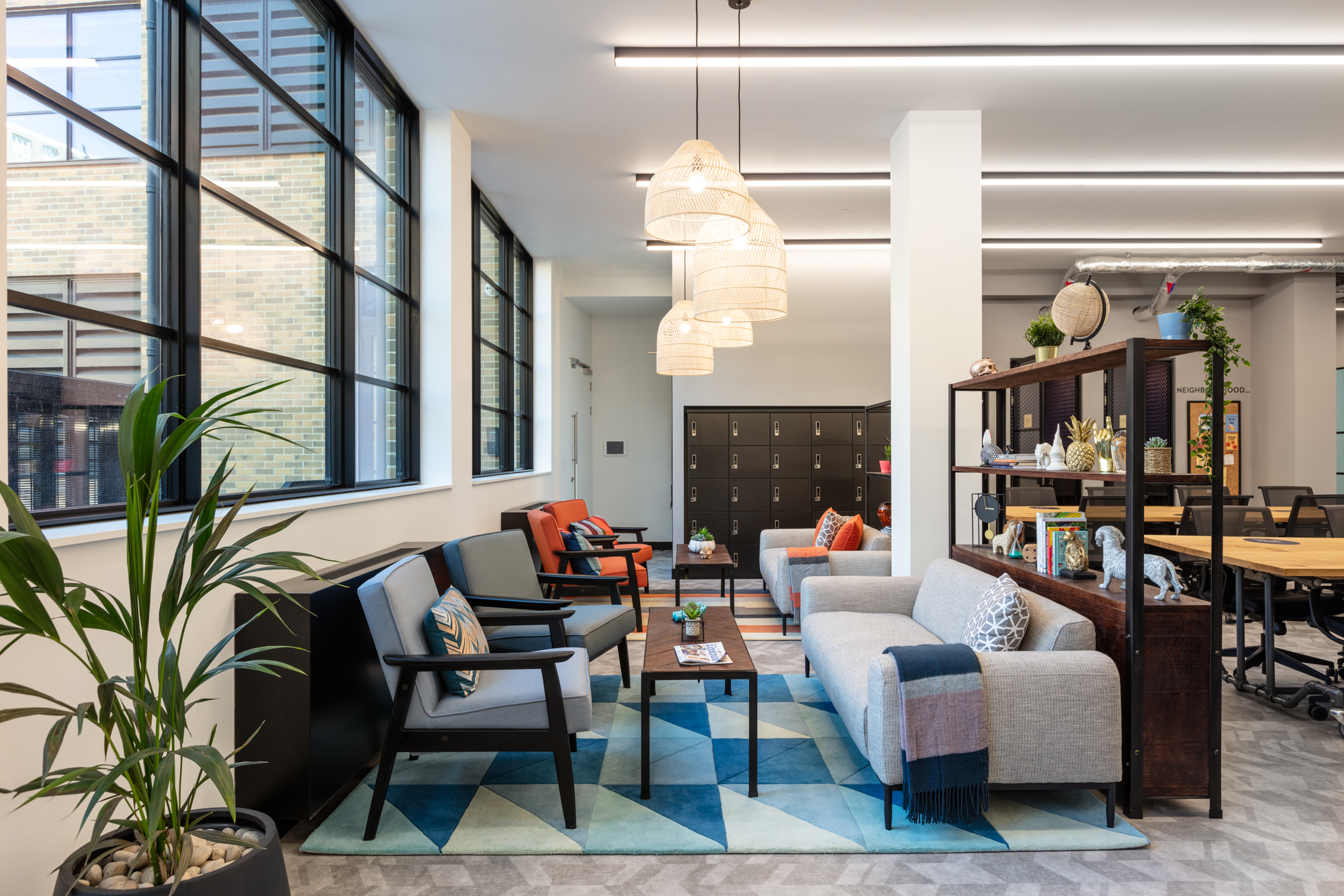 A welcoming communal area at Work.life Red Lion Street, combining natural light, stylish furniture, and a homely vibe, showcasing Two's expertise in workspace design.