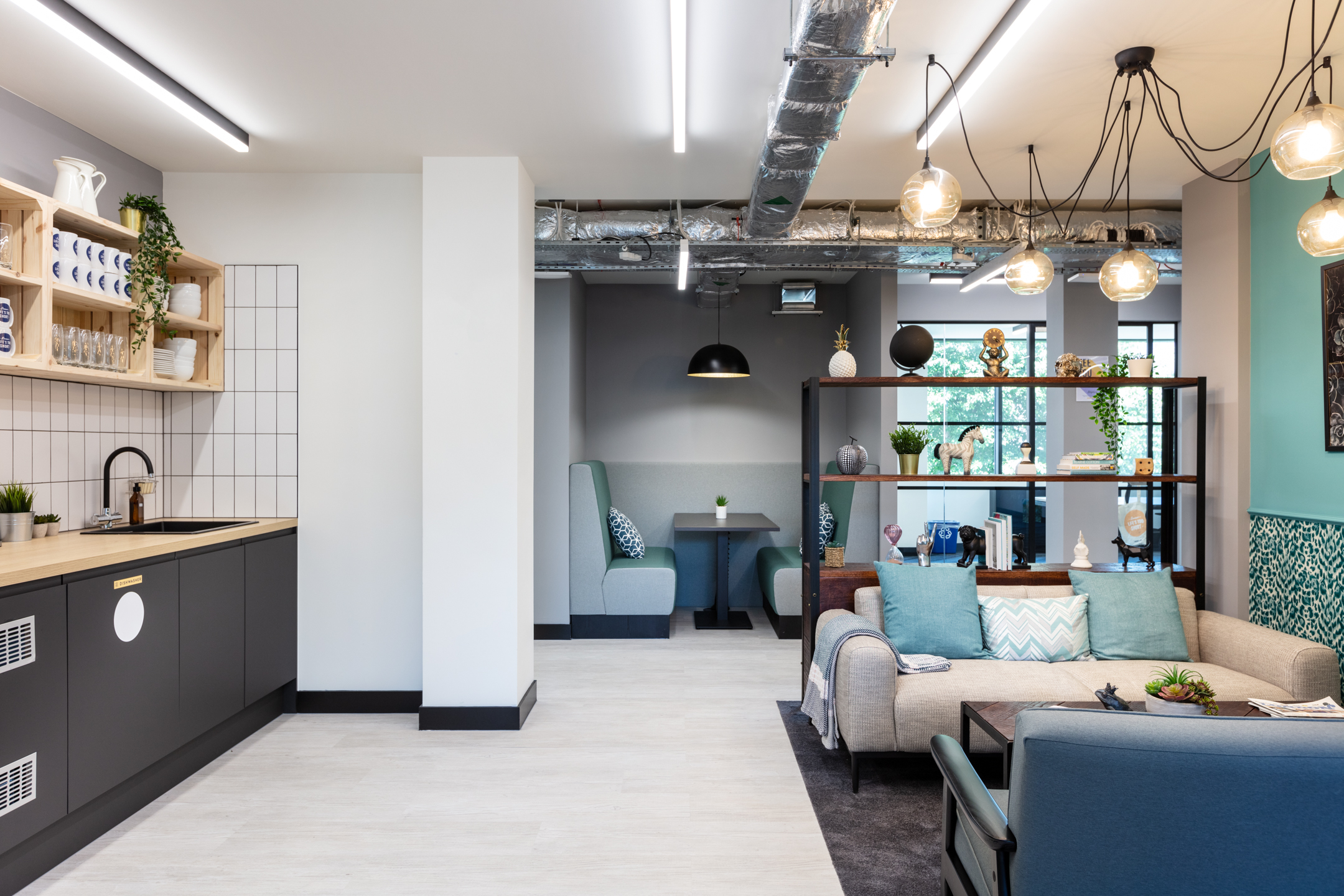 A cosy kitchenette and breakout area in Work.life Red Lion Street, with modern fittings and soft furnishings designed by Two to blend comfort with workspace efficiency.