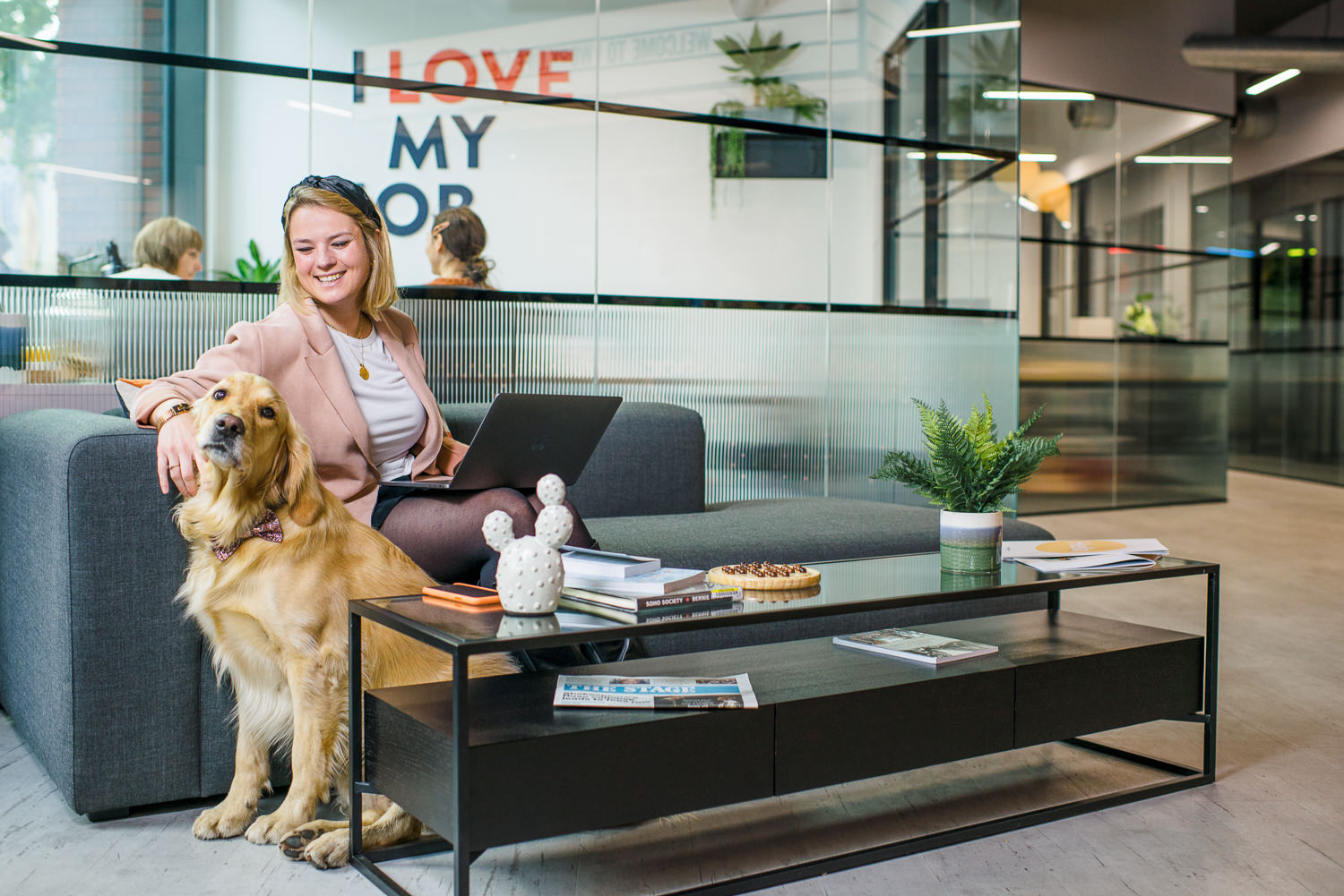 A professional and dog-friendly workspace at Work.life Soho, designed by Two, with cosy seating and a welcoming atmosphere for both people and pets.
