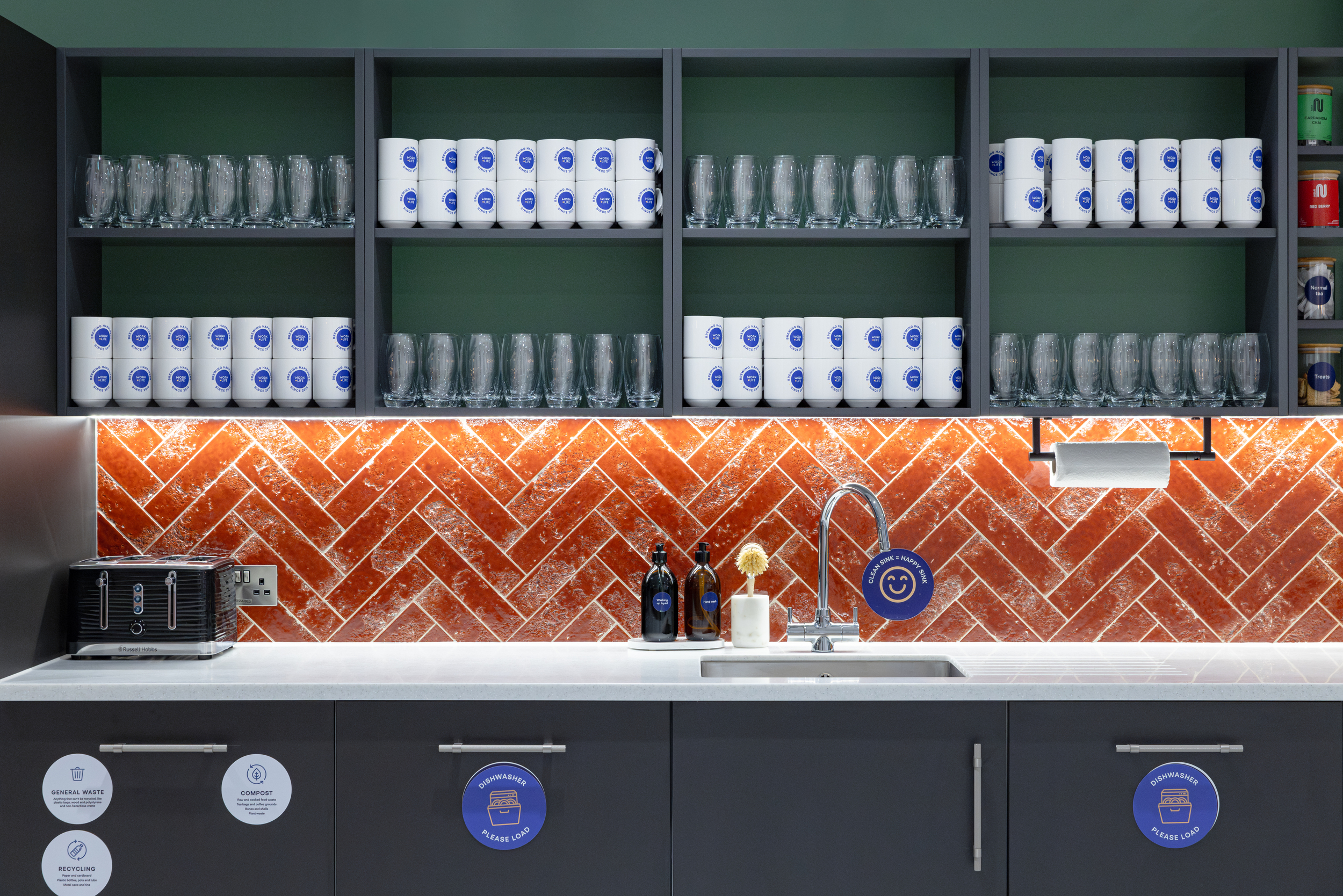 Work.Life Courtyard Building teapoint featuring the gemstone accents, branded Work.Life mugs and labelled kitchen appliances.