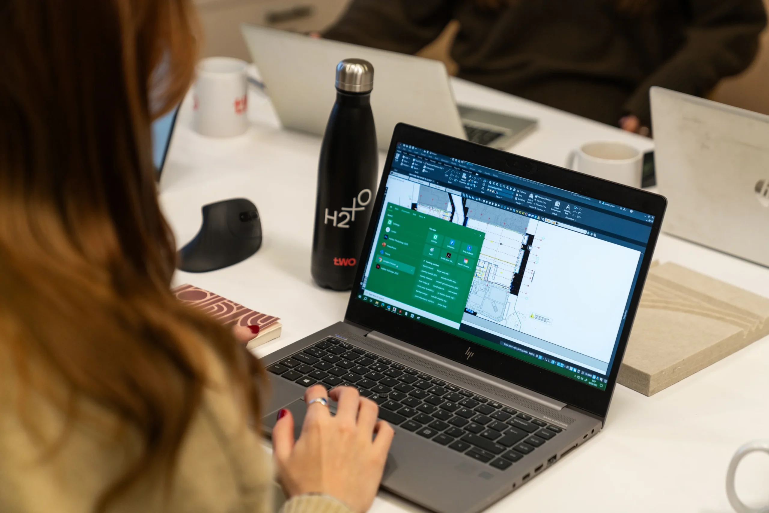 A women working on CAD for a Two project on her laptop